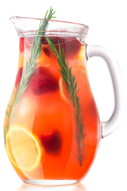 Strawberry rosemary lemonade or iced drink in a pitcher, isolated