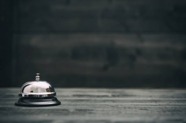 hotel ring on black wooden  background - ding imagens e fotografias de stock