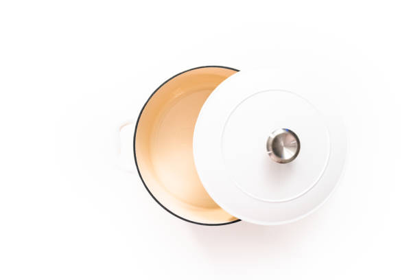 istock White enameled cast iron covered round dutch oven on a whjite background. 1196072483