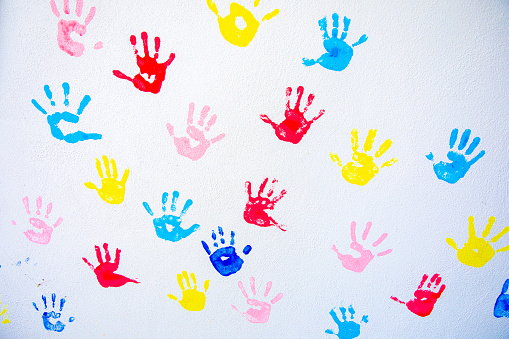 Children’s handprints on the wall