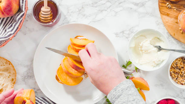 istock Slicing organic peach to make a ricotta 1196074336