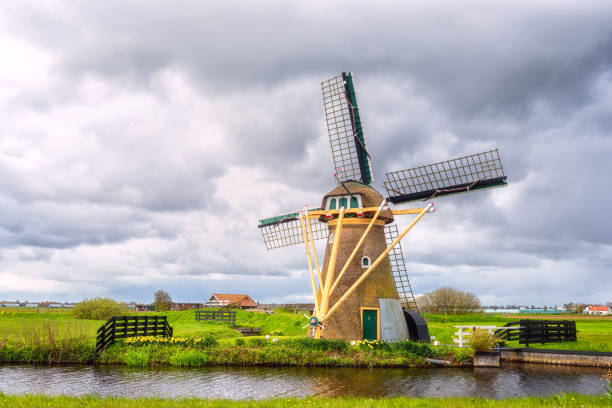 istock Scenic dutch rural landscape with traditional mill, spring in Netherlands 1196078404