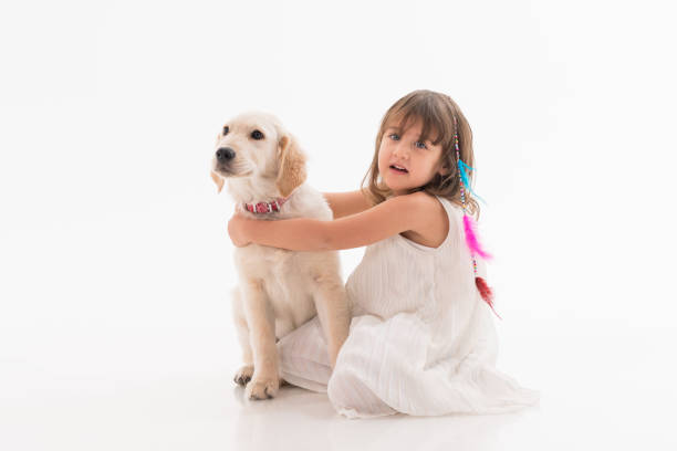 istock Happy girl wit his dog over white background 1196079200