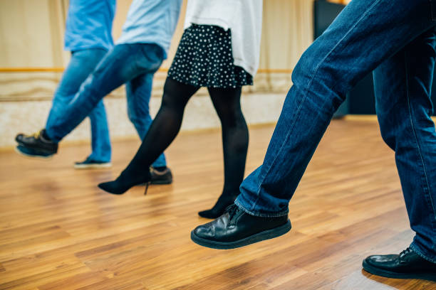 istock Dancing people in a row in the dance hall salon. Dancing school activity 1196083166