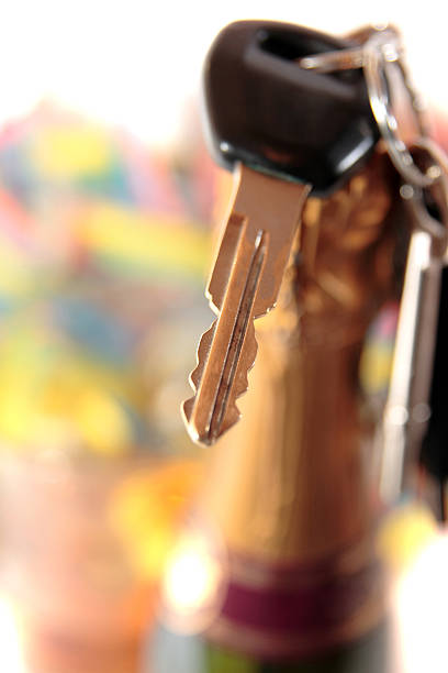 car keys and golden bottle top stock photo