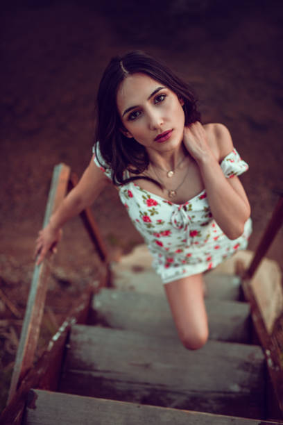 istock Female Climbing Beach House Steps 1196085025