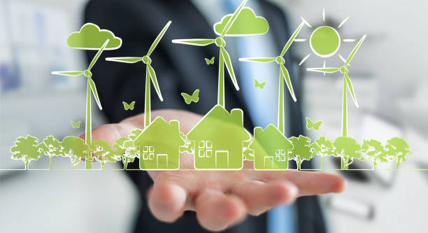 istock Businessman on blurred background hloding renewable energy sketch 1196085887
