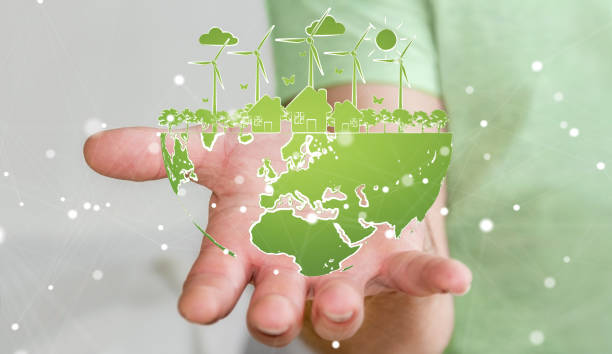 istock Businessman on blurred background holding renewable energy sketch 1196086013