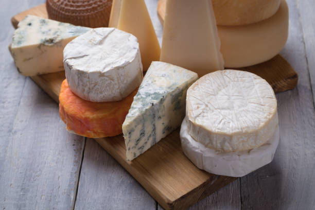 istock Aged cheese round and slices 1196086135