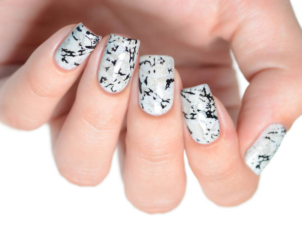 istock grey manicure with marblre effect with shimmer on a white background 1196088858
