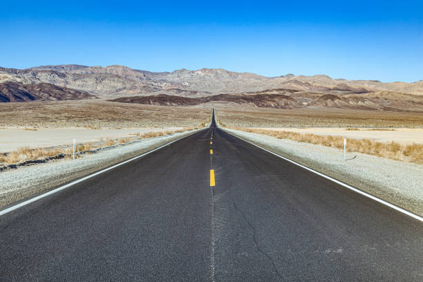 istock street through the death valley desert 1196089727