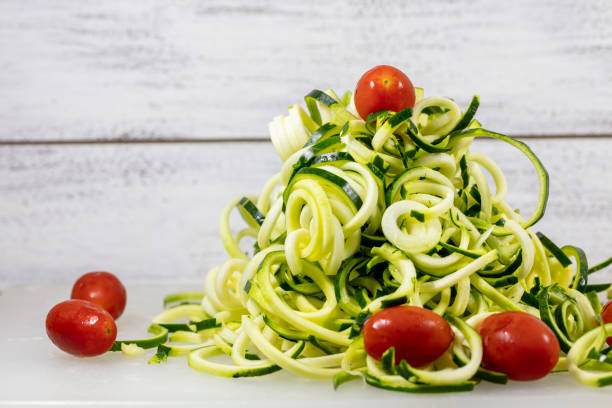 istock Spiralized Zucchini Noodles with Tomatoes on a Cutting Board 1196093674