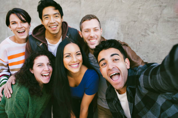 istock Friends Taking a Selfie - Smiling Having Fun and Happy 1196095083