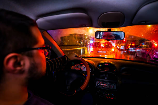 istock Driving car on rain night 1196098754