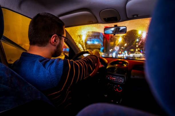 istock Driving car on rain night 1196098758