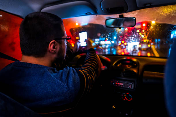 istock Man driving car and showing traffic jam 1196098900