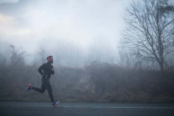 istock Man Running On The Road. 1196098901