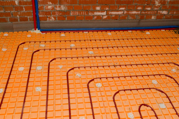 istock Close up on plumbing pipes water floor heating installation system interior 1196105288