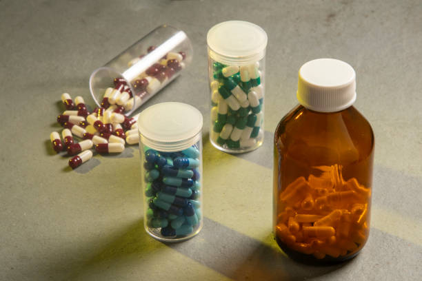 istock transparent bottle with medicine capsules 1196106817