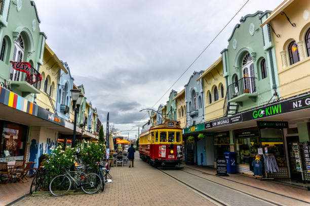 Christchurch, New Zealand - May 28, 2019: A tram passes through a narrow alleyway