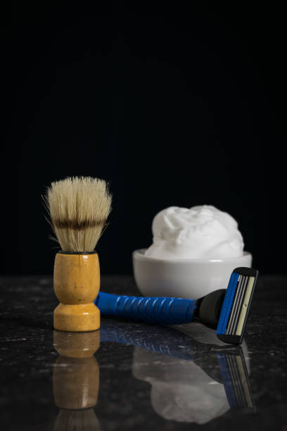 shaving brush with foam and razor on a stone on a black background. - 7651 imagens e fotografias de stock