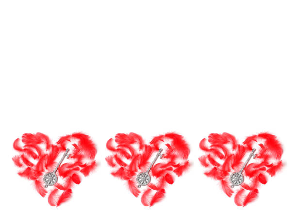 istock frame lined with decorative hearts of red feathers on a white background. minimal concept, flat lay, space for a text 1196112724