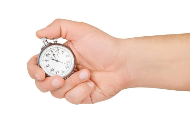 istock Hand hold mechanical analog stopwatch isolated on white 1196114792
