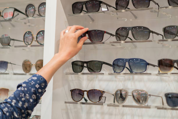 istock Women hand choosing sunglasses at the optical 1196123634