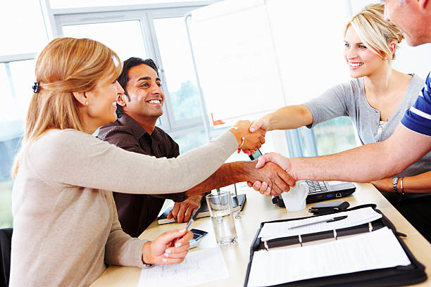 istock Multiracial business group shaking hands in meeting 119613287