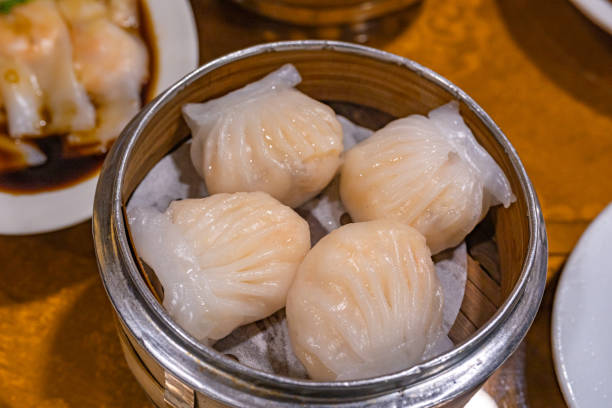 istock Crystal shrimp dumpling- xia jiao in bamboo dimsum steamer box 1196137168