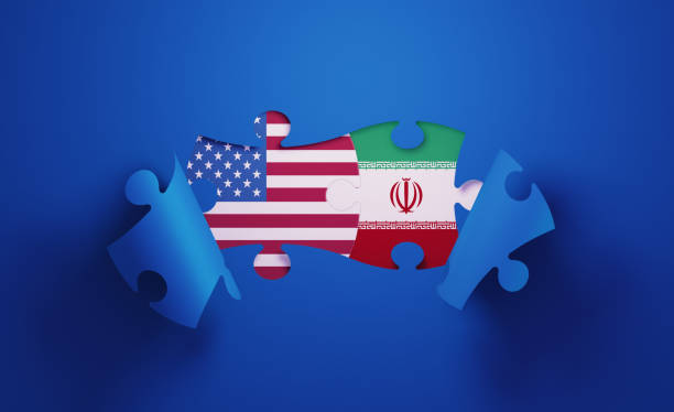 istock Jigsaw Puzzle Pieces Textured With American and Iranian Flags 1196144135