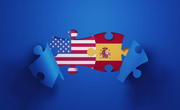 istock Jigsaw Puzzle Pieces Textured With American and Spanish Flags 1196144303