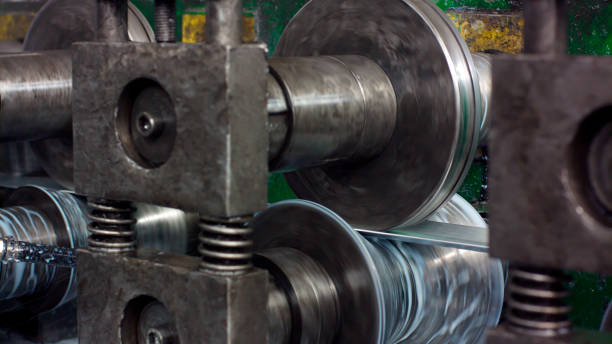 istock Industrial metal sheet coils connected with metal sheet profile forming machine 1196150059