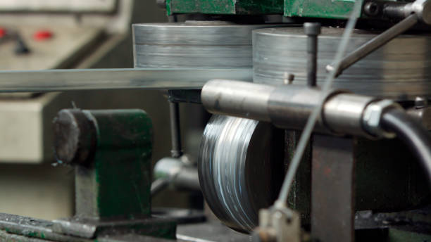 istock Industrial metal sheet coils connected with metal sheet profile forming machine 1196150076