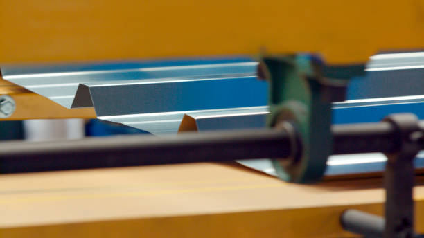 Metal press machine The industrial device for sheet metal bending by high precision metal sheet bending machine in factory. Close up. Selective focus. sandwich panel photos stock pictures, royalty-free photos & images