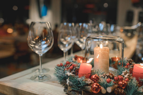 istock The burning candles and empty glasses on a table. 1196153833