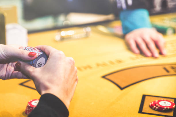 istock Black Jack table with cards and tokens 1196156430