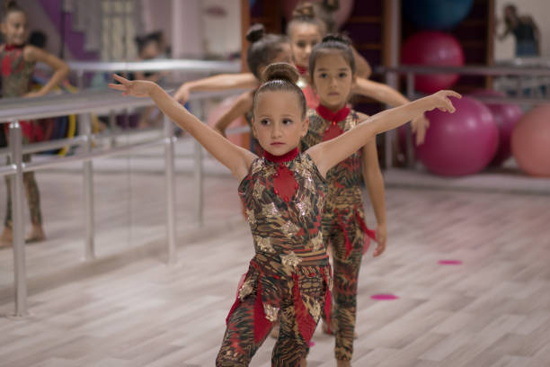 istock Young Girls Preparing for Ballet Training Indoors 1196157144