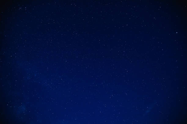 istock Milky way stars on a dark night sky. 1196161960