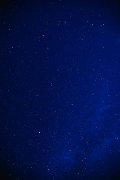 istock Milky way stars on a dark night sky. 1196162127
