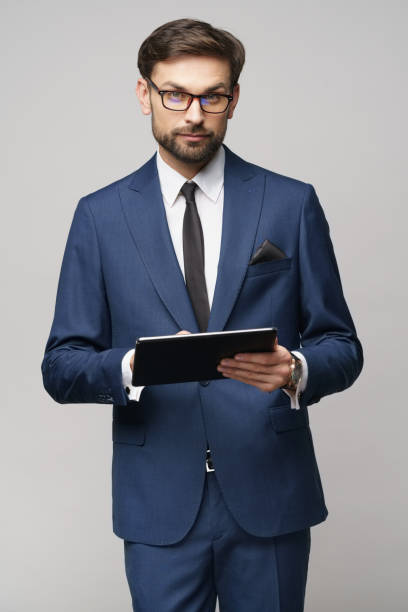 istock Young Businessman holding digital tablet pc pad 1196163335