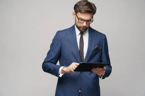 istock Young Businessman holding digital tablet pc pad 1196163337