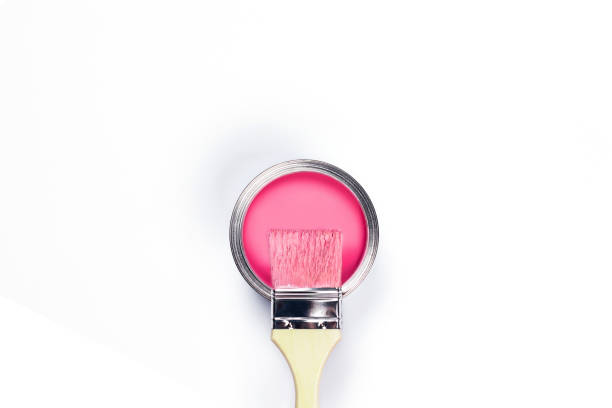 istock White background with pink paint jar. 1196164625