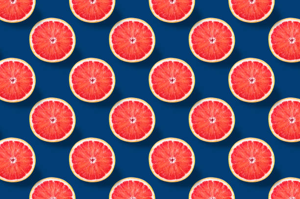 istock Vivid fruit pattern of fresh citrius on colourful background 1196164660