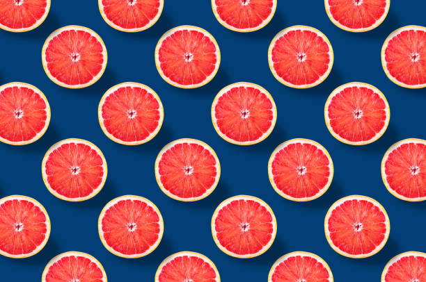 Vivid fruit pattern of fresh citrius on colourful background stock photo