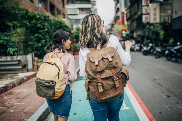 istock Two young women walking outdoors 1196164952