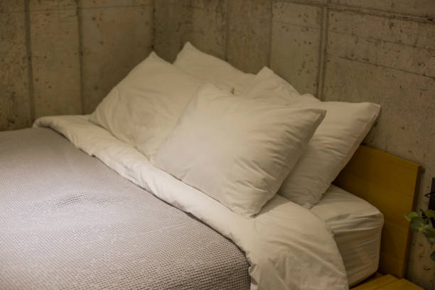 istock Pillows on a bed soft pillows on the bed 1196165698