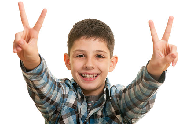 istock Laughing boy showing a victory sign 119616746