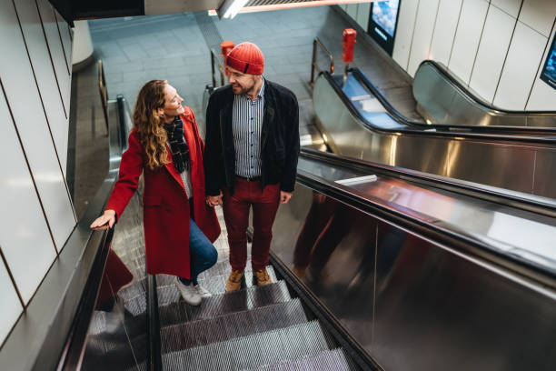 istock Couple in love on subway escalator 1196167596