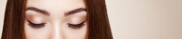 istock Female eye with long false eyelashes 1196167650